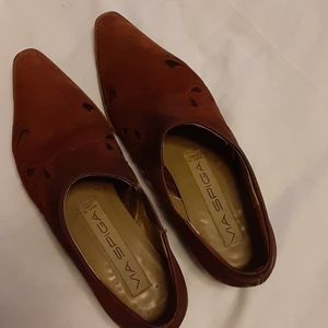 Russet colored low heel slip on ankle boots.